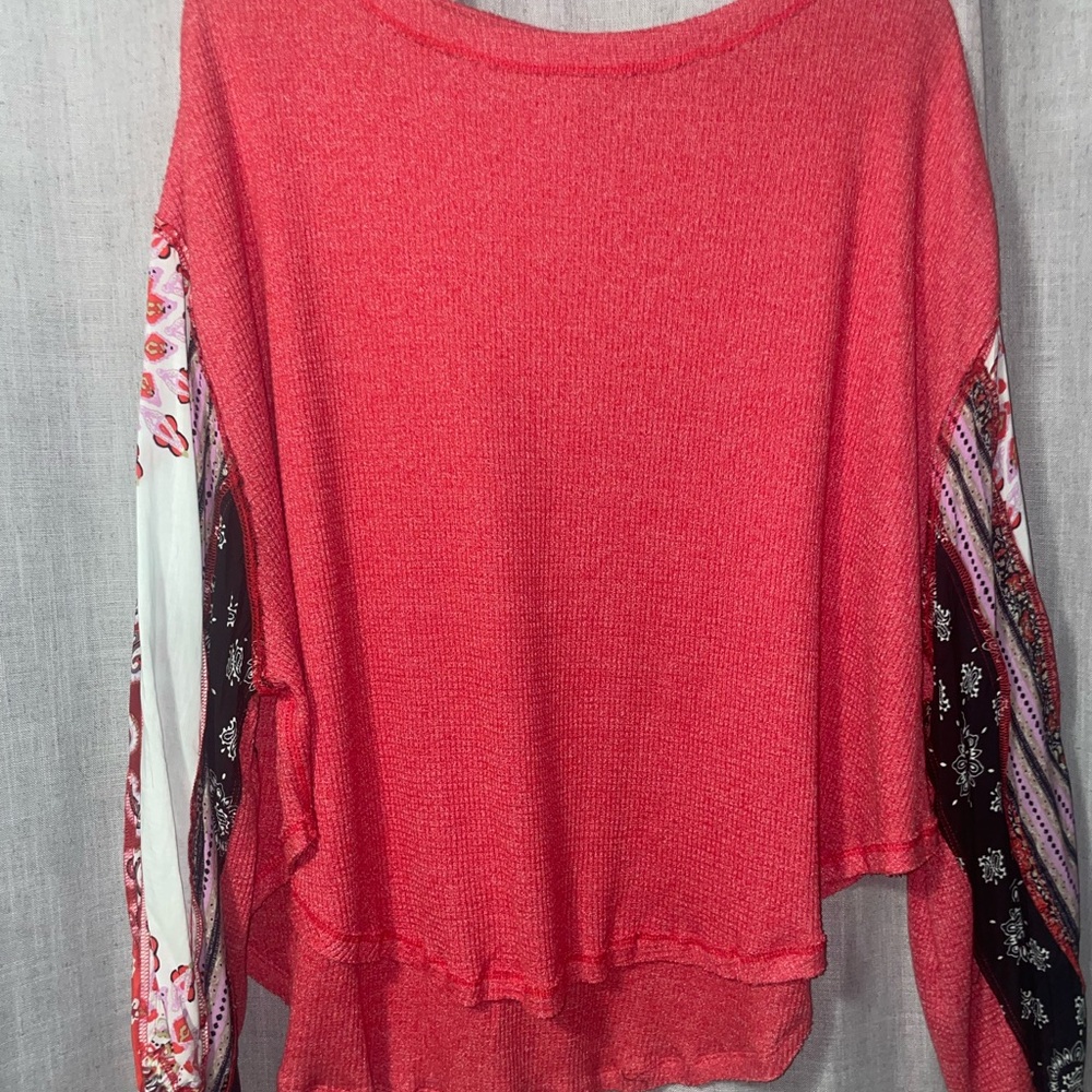 Chic Red Sweater with Patterned Sleeves